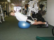 back strength training : reverse hyperextension on a ball